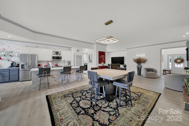 dining area featuring light wood finished floors