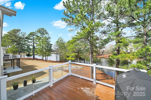 wooden terrace with a water view