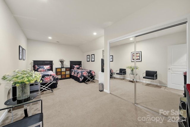 bedroom featuring recessed lighting, baseboards, a closet, and light colored carpet