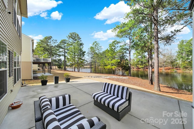 view of patio with a water view