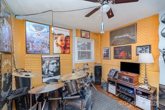 home office featuring ceiling fan and wallpapered walls