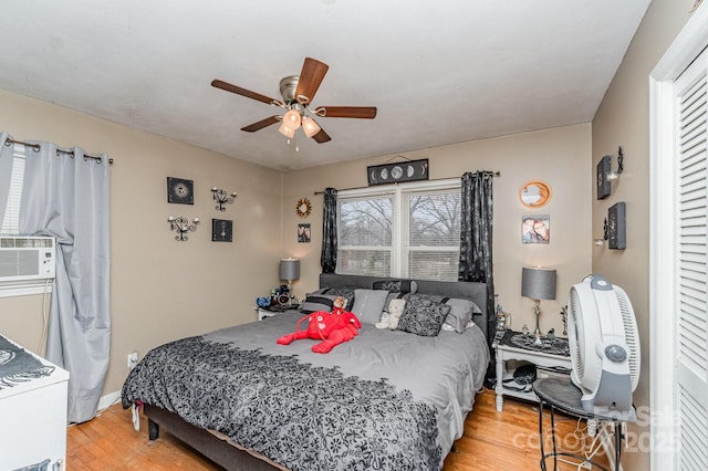 bedroom featuring ceiling fan and wood finished floors