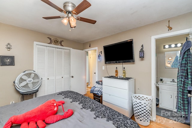 bedroom featuring a closet, ceiling fan, and wood finished floors