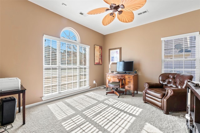 office area with baseboards, visible vents, and carpet flooring