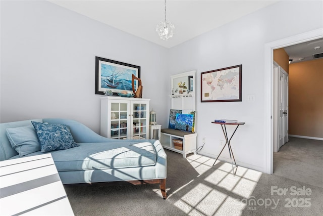 bedroom featuring an inviting chandelier, visible vents, baseboards, and light colored carpet