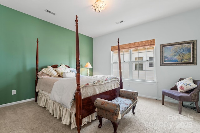 bedroom with visible vents, light carpet, and baseboards