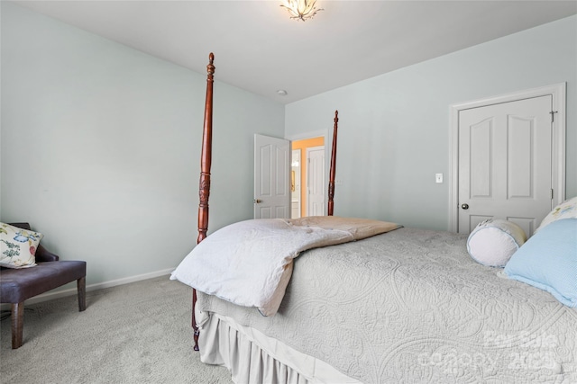 carpeted bedroom featuring baseboards