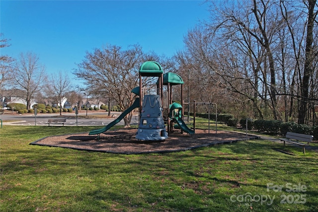 community jungle gym with a lawn