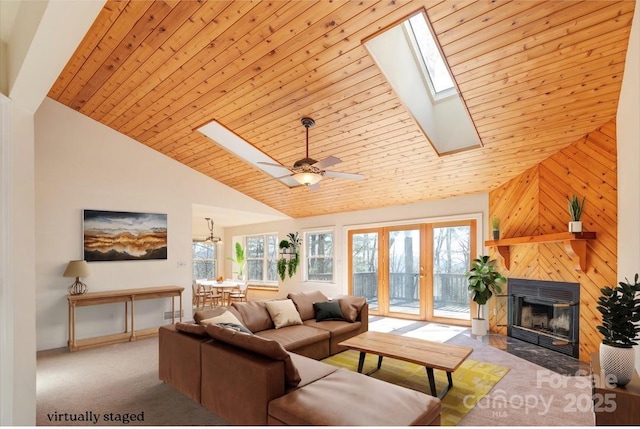 carpeted living room with wooden ceiling, high vaulted ceiling, a wealth of natural light, and a tile fireplace