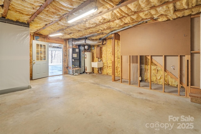 basement featuring gas water heater, a sink, and heating unit