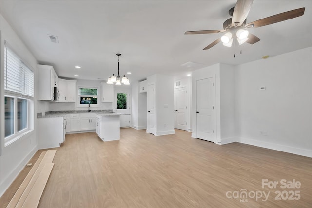 425 Messner St, Salisbury, NC 28144 - kitchen featuring white cabinets, ceiling fan, light wood finished floors, baseboards, and recessed lighting