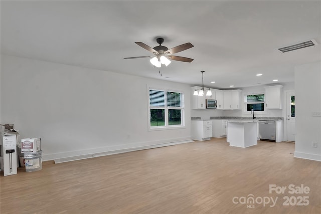 425 Messner St, Salisbury, NC 28144 - unfurnished living room featuring a ceiling fan, light wood-type flooring, a chandelier, recessed lighting, and baseboards