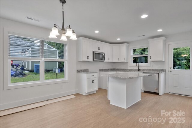 425 Messner St, Salisbury, NC 28144 - kitchen with stainless steel appliances, white cabinetry, light wood-style floors, recessed lighting, and hanging light fixtures