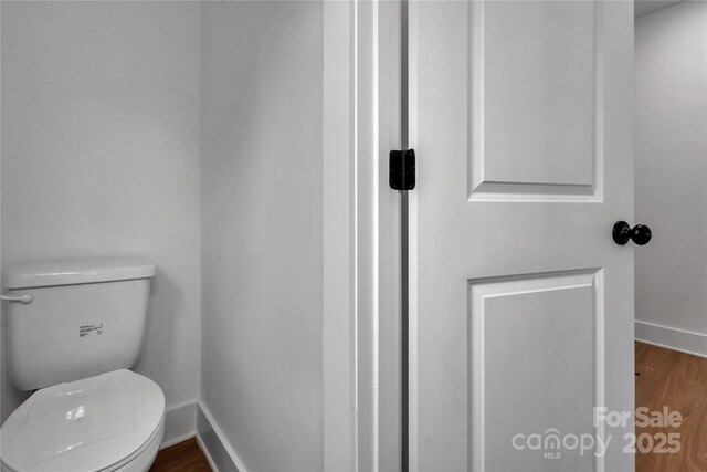 425 Messner St, Salisbury, NC 28144 - bathroom featuring baseboards, toilet, and wood finished floors