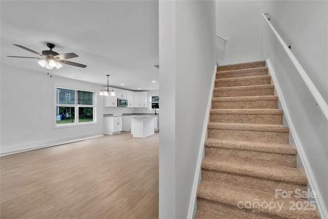 425 Messner St, Salisbury, NC 28144 - staircase featuring ceiling fan, recessed lighting, wood finished floors, and baseboards