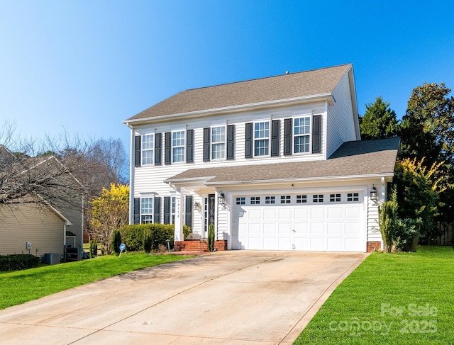 view of front of property featuring driveway, a garage, cooling unit, and a front yard