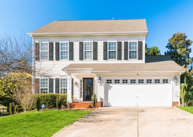 colonial house featuring driveway, a garage, roof with shingles, a front lawn, and brick siding