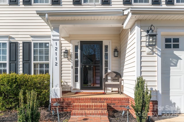 property entrance with an attached garage