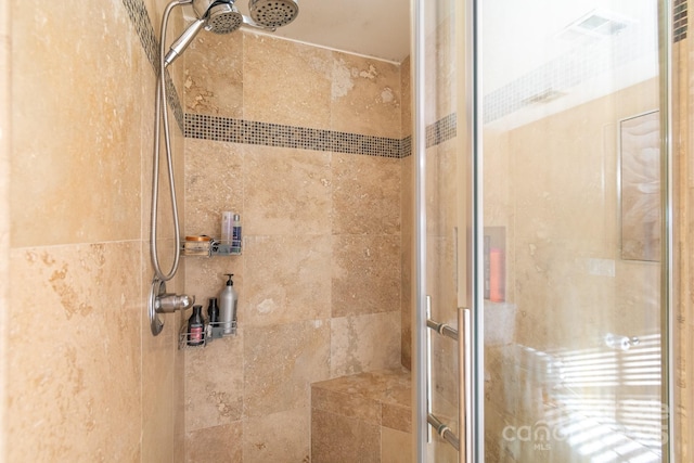 full bathroom featuring a stall shower