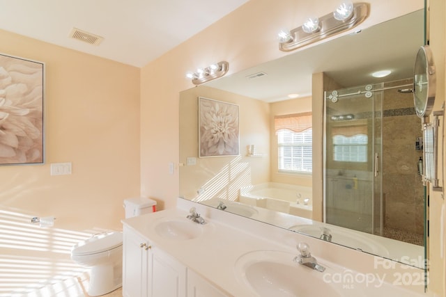 bathroom with visible vents, a sink, and a bath