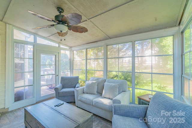 sunroom featuring ceiling fan and a wealth of natural light