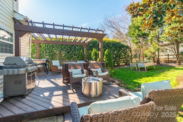 deck featuring fence, a lawn, grilling area, and a pergola