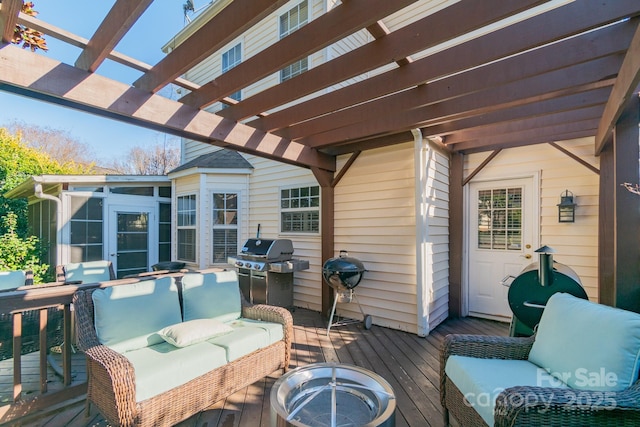 wooden deck featuring a sunroom, an outdoor living space, a pergola, and area for grilling