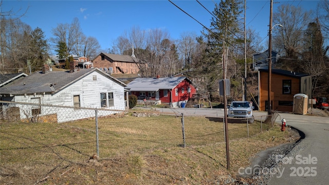 view of front of home with a front yard and a residential view