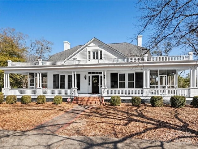 view of front of house featuring a chimney