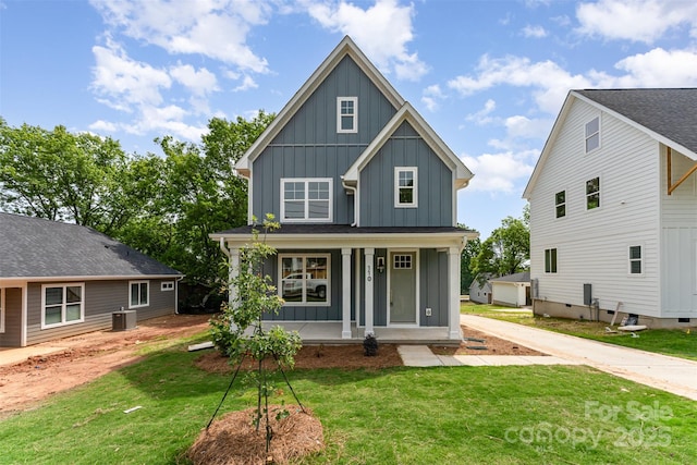 110 Walters St, Huntersville, NC 28078 - view of front of house featuring board and batten siding, covered porch, and a front yard