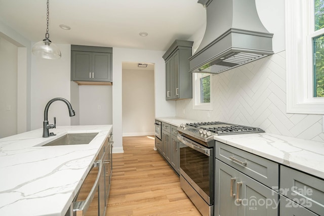 110 Walters St, Huntersville, NC 28078 - kitchen featuring stainless steel gas stove, custom range hood, gray cabinetry, and recessed lighting