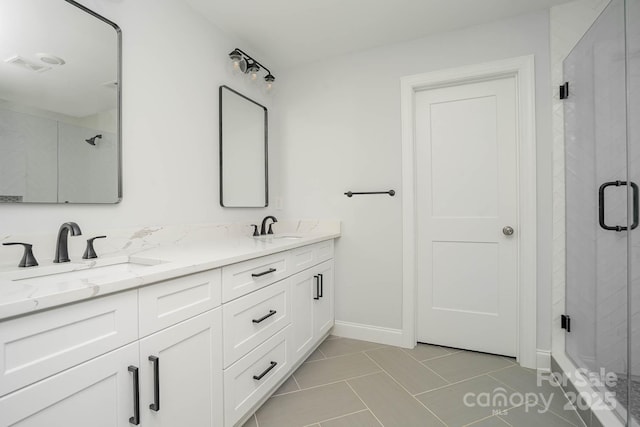 110 Walters St, Huntersville, NC 28078 - full bathroom with a stall shower, double vanity, baseboards, and tile patterned floors