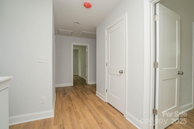 110 Walters St, Huntersville, NC 28078 - corridor featuring attic access, light wood finished floors, and baseboards