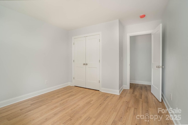 110 Walters St, Huntersville, NC 28078 - unfurnished bedroom featuring light wood-type flooring, baseboards, and a closet