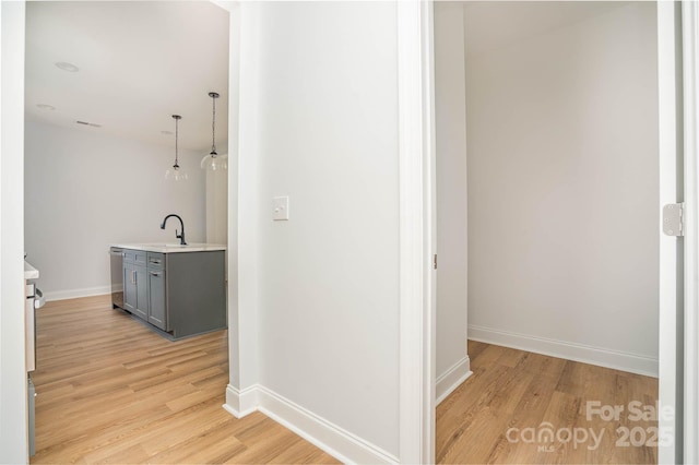 110 Walters St, Huntersville, NC 28078 - hallway with light wood-style floors, baseboards, and a sink