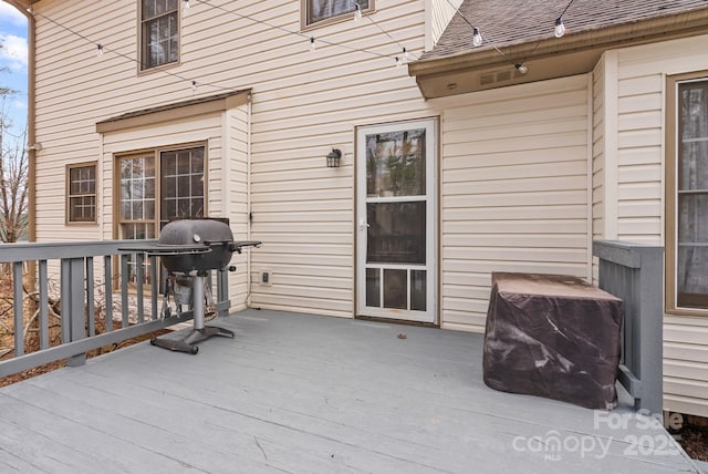 wooden deck with area for grilling