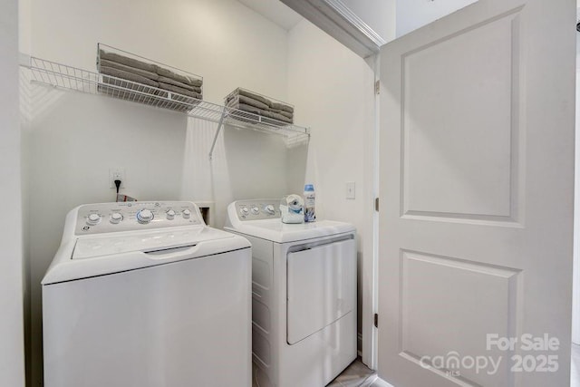 laundry room with independent washer and dryer and laundry area