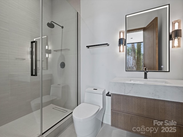 bathroom with a stall shower, vanity, and toilet