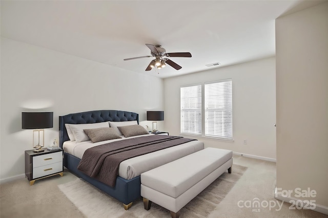 bedroom with light carpet, baseboards, visible vents, and a ceiling fan