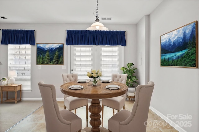 dining area with visible vents and baseboards