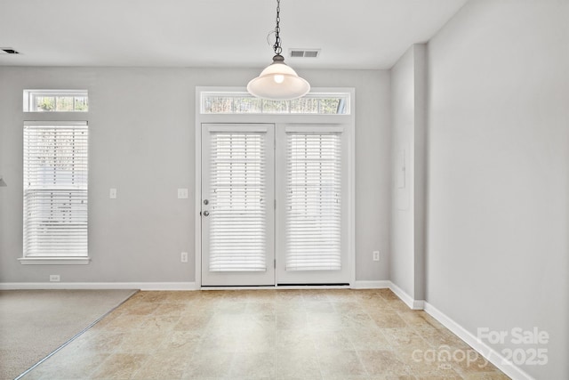 entryway with visible vents and baseboards