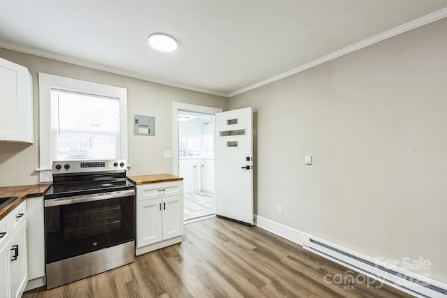 kitchen with a baseboard heating unit, butcher block countertops, white cabinetry, light wood-type flooring, and stainless steel electric range