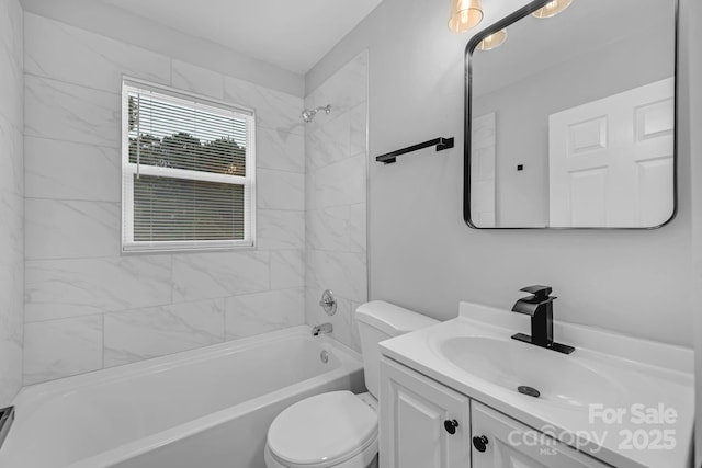 full bathroom featuring toilet, bathing tub / shower combination, and vanity