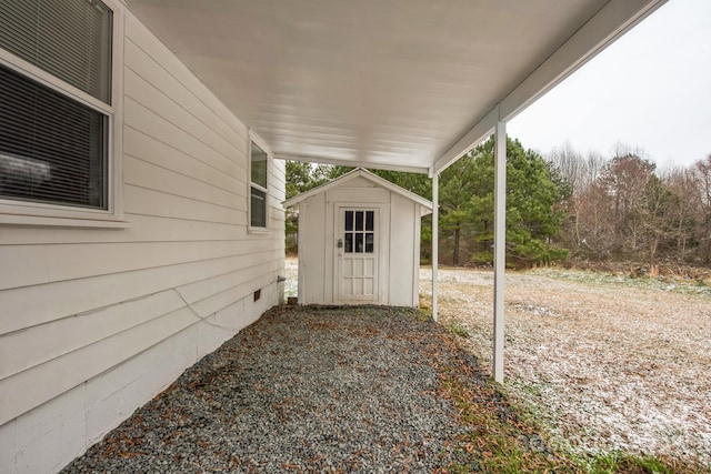 exterior space with a storage unit and an outdoor structure