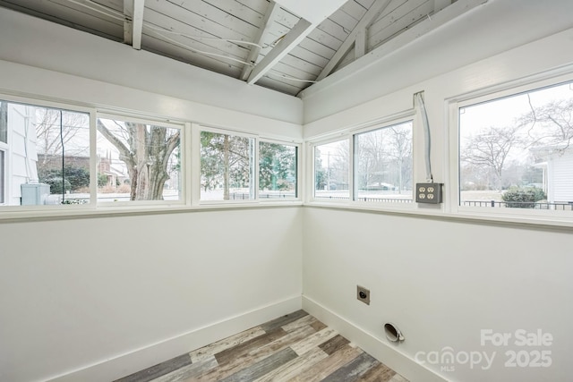 washroom with a healthy amount of sunlight, laundry area, baseboards, and hookup for an electric dryer