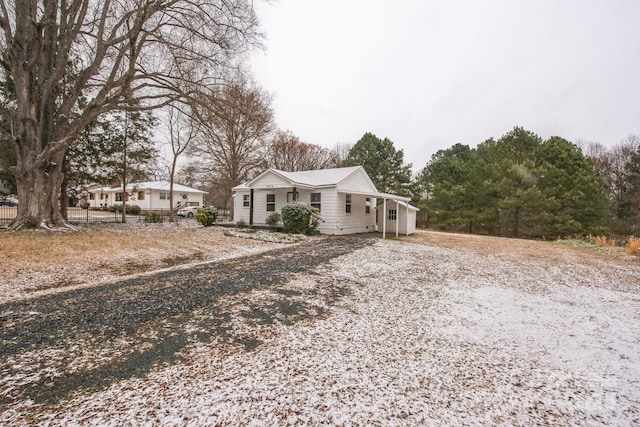 view of front of home featuring fence