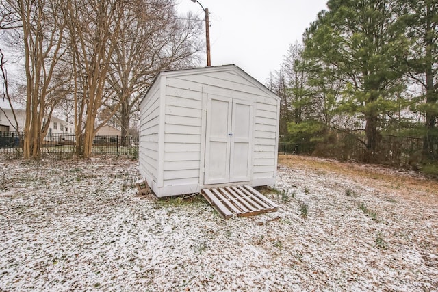 view of shed with fence