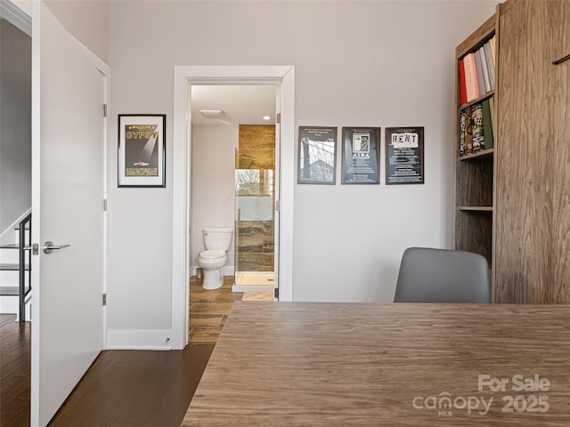 unfurnished office with dark wood-type flooring