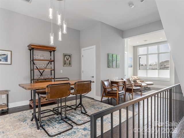 dining room featuring baseboards and wood finished floors