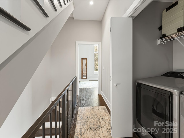 laundry room with laundry area, separate washer and dryer, dark wood-type flooring, and recessed lighting